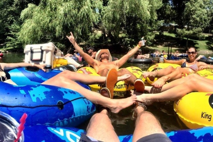 a group of people riding on the back of a boat