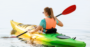 a girl riding a wave on a surfboard in the water