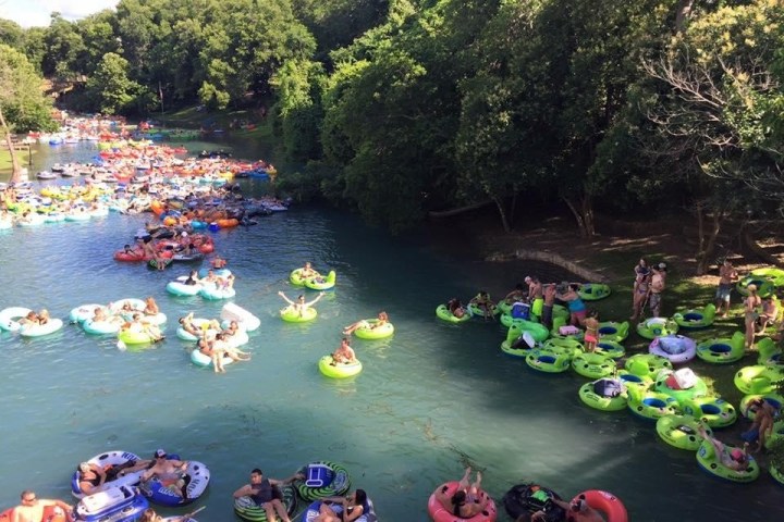 a group of people on a boat in the water