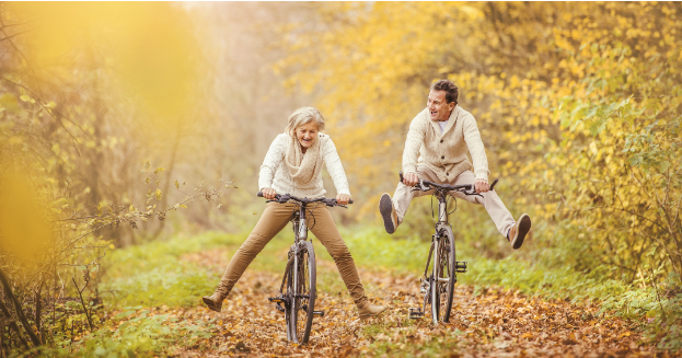 a person riding on the back of a bicycle